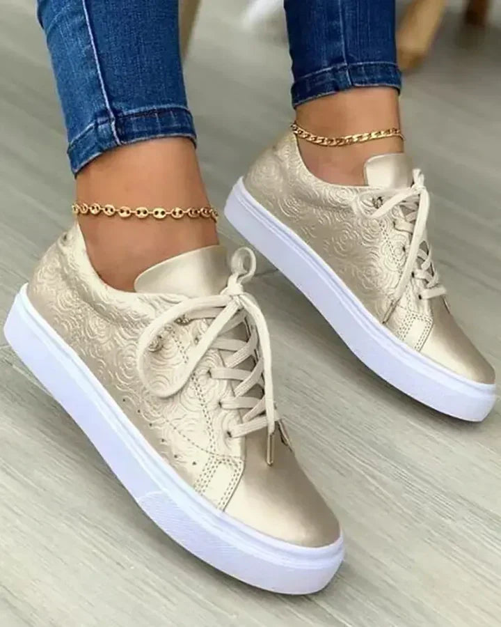 Stylish sneakers featuring gold accents