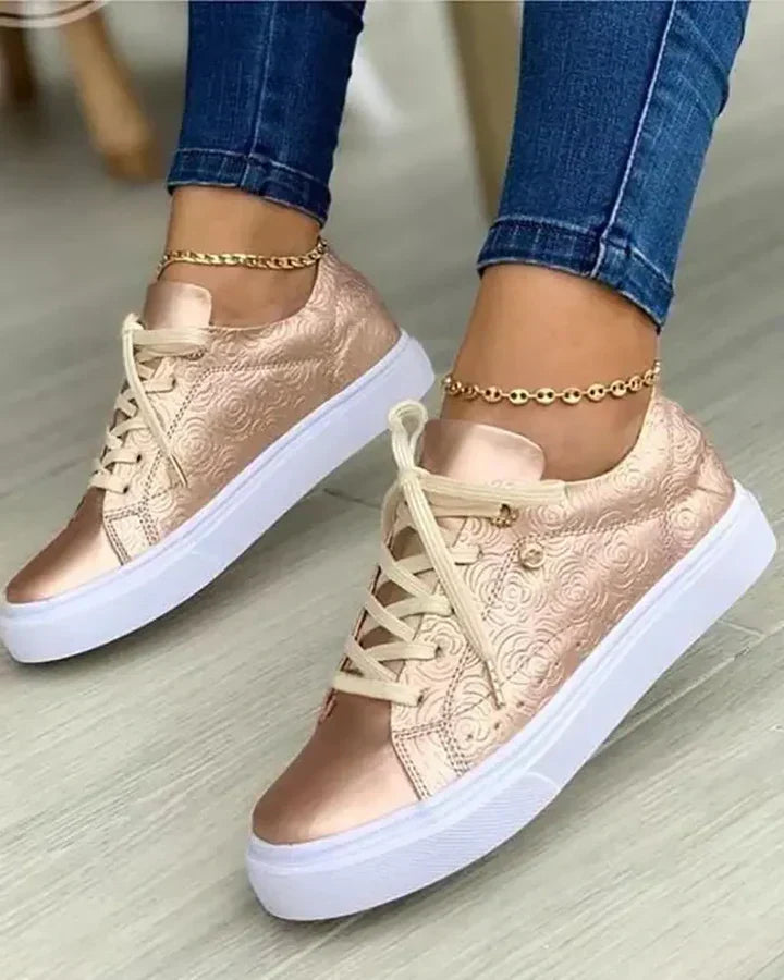 Stylish sneakers featuring gold accents