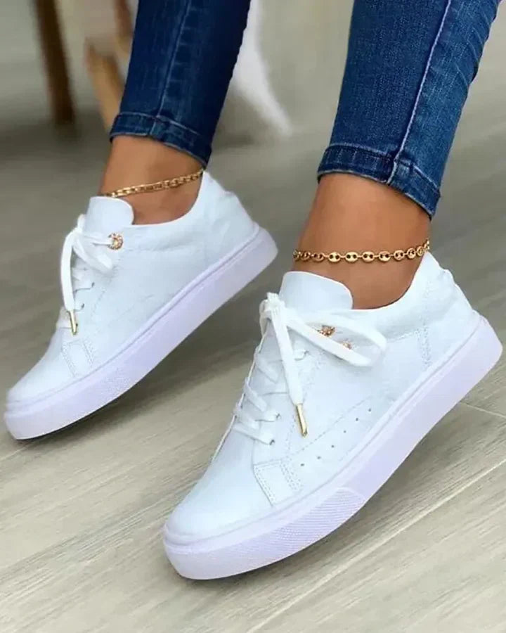 Stylish sneakers featuring gold accents