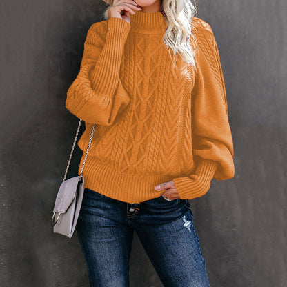Women's chunky knit sweater with high collar and voluminous sleeves