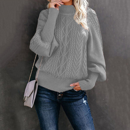 Women's chunky knit sweater with high collar and voluminous sleeves
