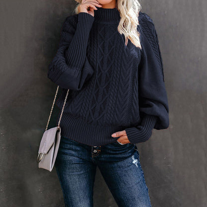 Women's chunky knit sweater with high collar and voluminous sleeves