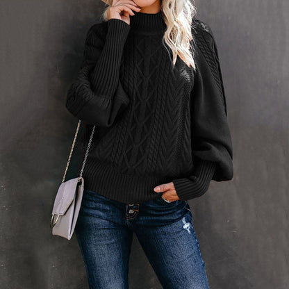 Women's chunky knit sweater with high collar and voluminous sleeves