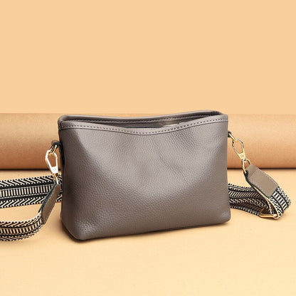 Small shoulder bag for women with wide guitar strap