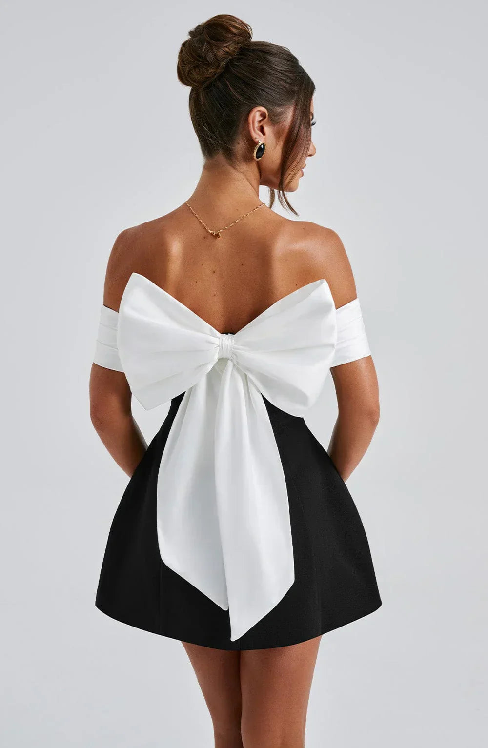 Chic Little Black Dress with Feminine Bow Accents - BritishElegance